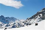 snow rocks and nice italian mountians over blue sky