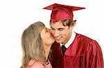 Young graduate receiving a kiss from his mother.  Isolated on white.