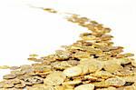 many of gold coins making curved path