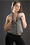 pretty and young woman with a waistcoat looking in camera