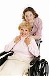 Teen girl with her disabled grandmother.  Isolated on white.