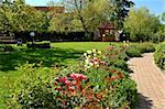 Garden with tulips, gazebo and path