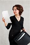 Close up of a young business woman, on grey background