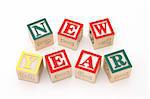 word new year formed by wood alphabet blocks