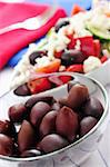 Black kalamata olives and greek salad with feta cheese