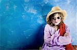 Mad Young Girl Wearing a Straw Cowboy Hat and Funny Sunglasses