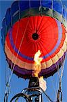 Close-up view of a colorful hot air balloon being inflated with hot air