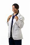 Female attractive African American doctor wearing white lab coat and a stethoscope around shoulders smiling standing on white background