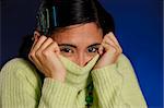 Portrait of hispanic winter girl wearing green sweater