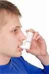Teenager holding an inhaler isolated on white