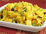 A colorful Indian rice dish made from basmati rices, spices, and fresh vegetables.