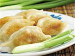 Jiaozi, or potstickers, a popular appetizer on Chinese restaurant menus. Traditionally eaten during Chinese New Year.