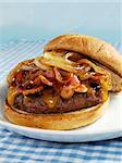 A juicy sirloin burger topped with cheddar cheese, bacon, barbecue sauce, and sauteed onions. Served on a toasted wheat bun.