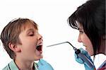 Closeup of a boy opening his mouth while a  doctor examining him using a bent arm illuminator.