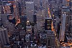 Overhead view of buildings in Midtown Manhattan in New York City in early morning light.