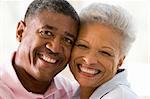 Couple relaxing indoors and smiling