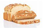 A slices of bread reflected on white background. Shallow depth of field