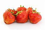 Some tasty ripe red strawberries isolated on the white background