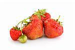 Some red ripe and one unripe strawberries isolated on the white background