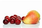 Yellow-red pear and some cherry plums isolated on the white background