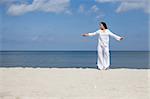 attractive brunette woman relaxing on the beach