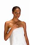 Beautiful young African-American woman with Slicked Back Hair wrapped in white bath towel preparing for sauna