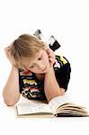 Reading young boy at white background