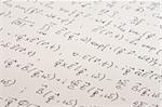 Physical equations (electromagnetics) hand written on paper