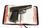 the gun on Bibles. Photo is isolated