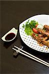 chicken teriyaki on white dish, lot of copyspace