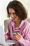 Woman making online purchase at home