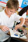 A schoolboy in a science class