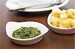 Parsley and bread croutons on wood background. Shallow depth of field