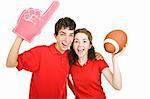 Cute teen couple excitely cheering for their football team.  Isolated on white.