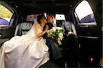 Kiss of a newly-married couple in car