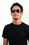 Portrait of young trendy man wearing sunglasses isolated