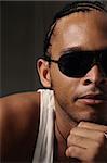 Portrait of young trendy african man wearing sunglasses