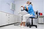 doctor works with patient in the dentist office