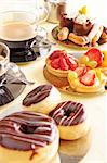 Freshly brewed coffee with a selection of cakes and confectionery.