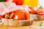 A fresh ham and tomato sandwich
