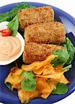 Crumbed tuna croquettes with sweet potatoes and a rocket salad.