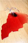 wine spilled on hardwood floor - red wine glass