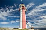 A wide angle shot of a small community lighthouse on the outskirts of Brigus, Newfoundland Canada.