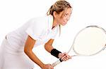 side view of tennis player going to play against white background