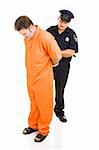 Police officer placing handcuffs on prisoner in orange prison jumpsuit.  Full body isolated on white.