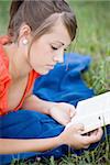 young girl relaxing and reading a book