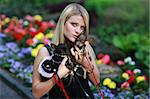 Beautiful blond girl with two fancy  little dogs