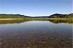 blue river with pebbles landscape