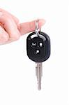 holding automobile keys isolated on white background