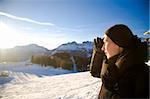 Young Woman In The Alps Mountains Looking Forward. Winter Sport Series.